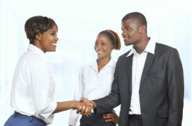 man and woman shaking hands with each other