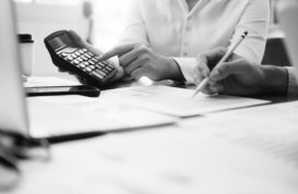 portrait of a woman hands showing something from a calculator